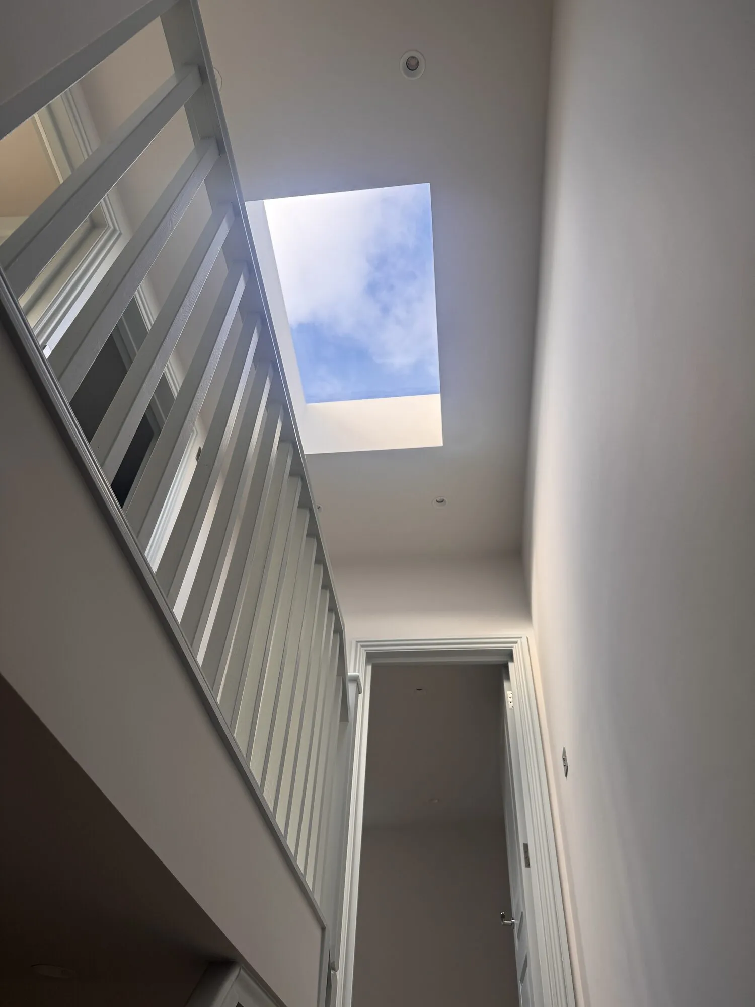 New staircase up to the loft conversion, lit by a large rooflight over the stairwell