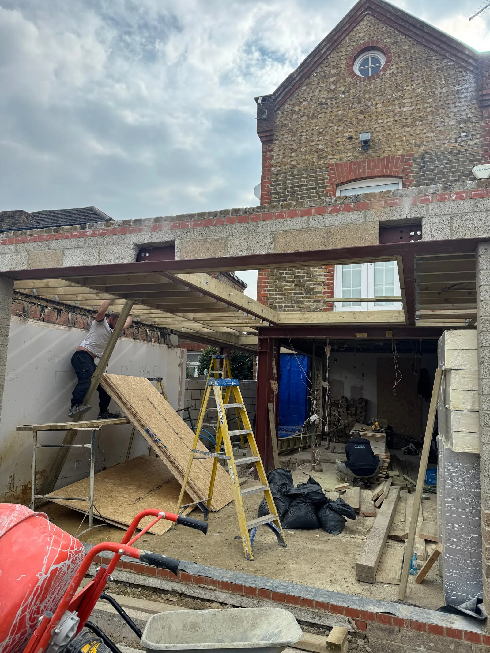 New steel and timber structure against the original brickwork