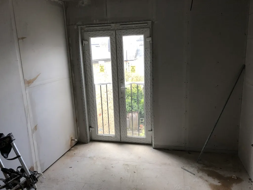 Juliet balcony doors installed in the boarded-out loft conversion