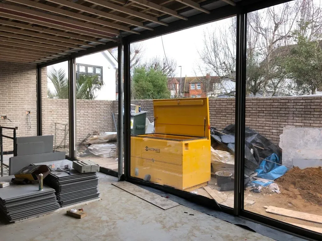 First-fix services and newly installed structural glazing in the Wandsworth new-build