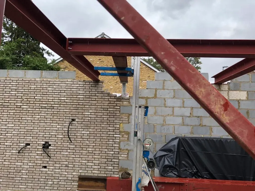 Structural steel beams over new blockwork on a new-build house in Wandsworth